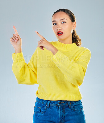 Buy stock photo Pointing, shock and presentation with portrait of woman in studio for show, advertising and idea. Announcement, wow and deal with person on grey background for opportunity, offer and news mockup