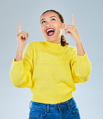 Buy stock photo Wow, excited and woman pointing to presentation, news or announcement for creative opportunity. Show, information and happy person or model in surprise, idea or solution on a studio white background
