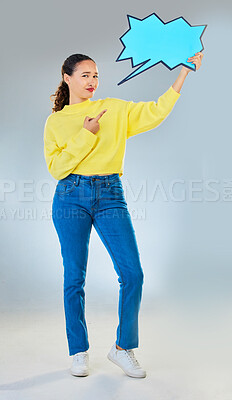 Buy stock photo Speech bubble, portrait and woman pointing to chat, social media opinion and confused, translation or communication. Gen z person in doubt, question and language mockup or quote on studio background