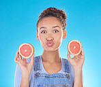 Portrait, kiss and woman with grapefruit in studio isolated on a blue background. Face, fruit and person with food for healthy diet, nutrition or wellness, eating and vitamin c, benefits and vegan.