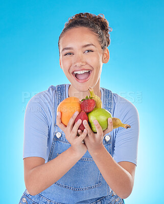 Buy stock photo Happy, health and portrait of woman with fruit in studio for healthy eating, wellness and diet. Food, lose weight and female person on blue background with apple, orange and banana for nutrition