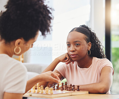 Buy stock photo Chess, friends and women with board for game moving piece for strategy, thinking and challenge. Competition, planning and African female people with chessboard in living room playing to checkmate