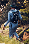 Hiking, travel and back of woman with stick for outdoor fitness, path and gear. Freedom, adventure or female hiker walking with trekking pole for exercise, health or balance in nature, trail and hill