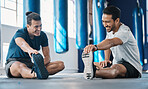 Men smile, gym and legs stretching of friends before training, fitness and workout in health club. Warmup, athlete and man ready to start sport exercise together on the floor with personal trainer