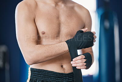 Buy stock photo Sports, boxing and man wrap hands in gym for training, workout and exercise for mma fight. Fitness, body builder and male athlete with bandage prepare for boxer competition, practice and performance
