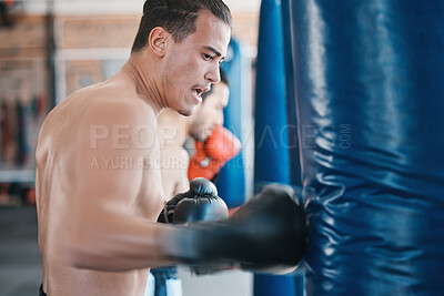 Buy stock photo Sports, boxing and man with punching bag in gym for training, cardio workout and exercise. Fitness, body builder and male athlete with equipment for boxer competition, practice and mma performance