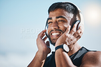 Buy stock photo Thinking, beach and a man with music for fitness, running motivation and ideas in nature. Smile, wellness and an athlete listening or streaming a podcast while training or exercise vision at the sea