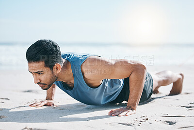 Buy stock photo Man, beach and pushup on sand for workout, fitness or exercise for performance in summer sunshine. Young guy, bodybuilder and training for health, wellness and strong body with self care on ground