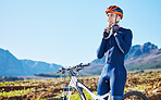 Mountain, helmet and man cycling in a competition, fitness training or sports adventure in summer with blue sky. Gear, athlete and safety in outdoor cycle, bike ride or exercise in nature or park