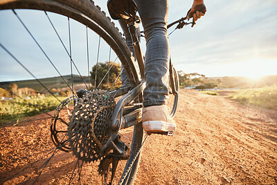 Buy stock photo Feet, cycling and a man on a bike and dirt road for fitness, morning cardio or adventure in nature. Sports, tire and a person on a bicycle for a race, competition or exercise in the countryside