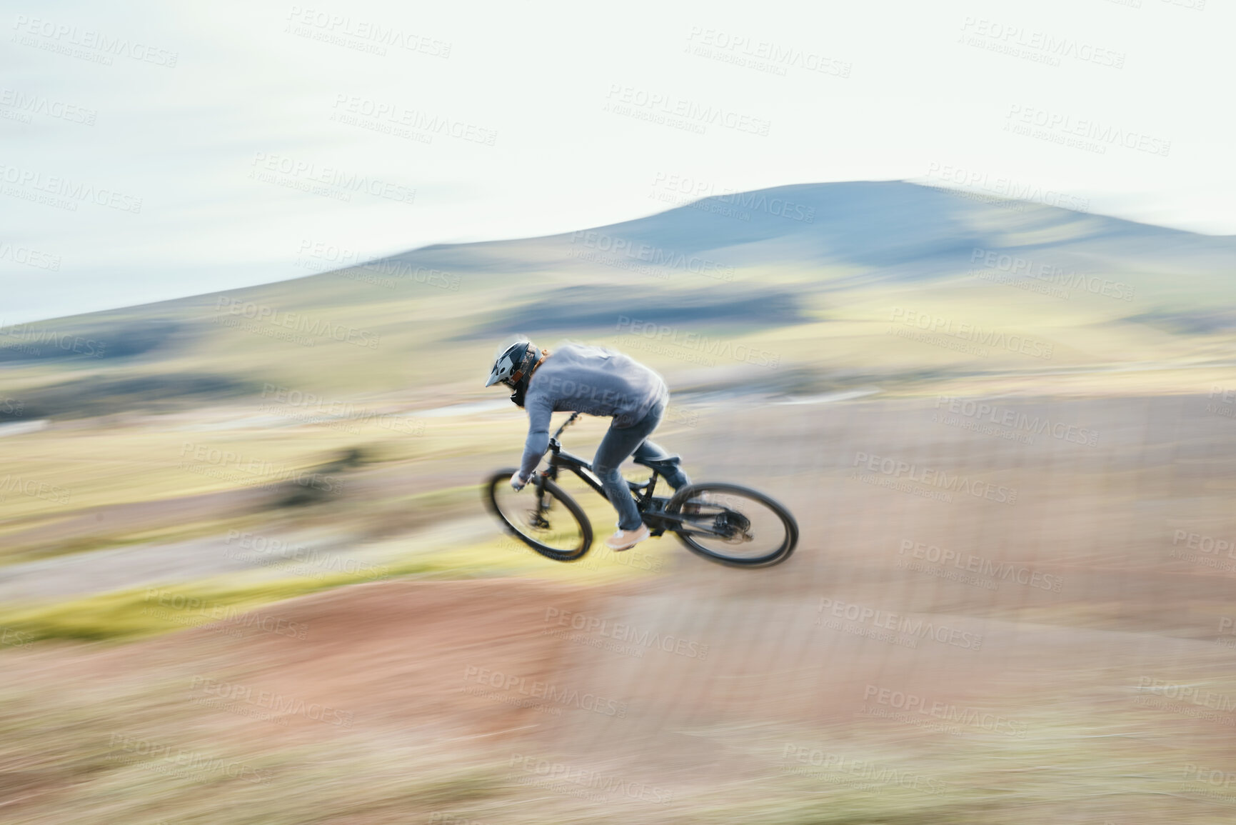 Buy stock photo Sports, energy and man riding a bike in nature training for race, marathon or competition. Fitness, blur motion and male athlete biker practicing for an outdoor cardio exercise, adventure or workout.