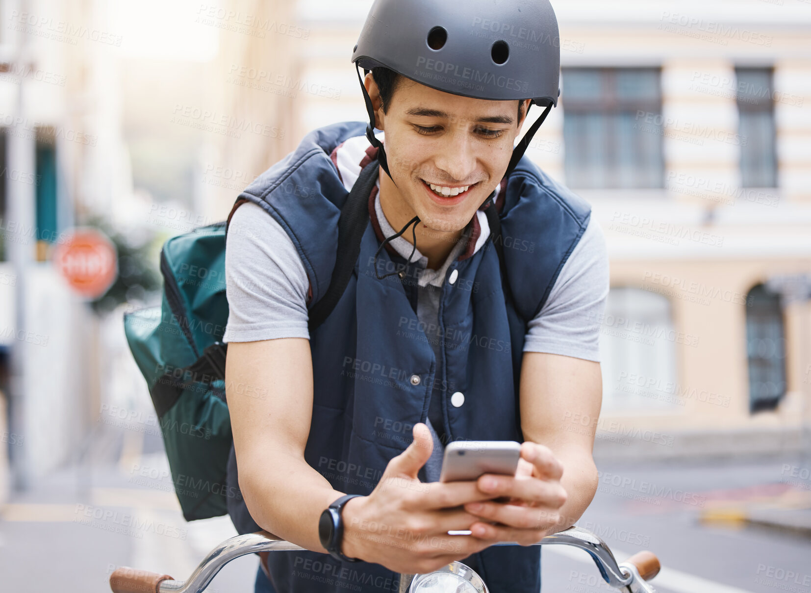 Buy stock photo Man, courier bicycle and smile with phone, order or e commerce app for food, product and sustainable transport. Young guy, bike and metro street with texting, chat and eco friendly with logistics job