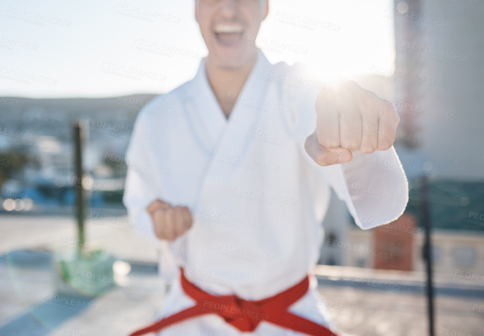 Buy stock photo Karate, fitness and fight with a sports man in gi, training in the city on a blurred background. Exercise, discipline or power with a male athlete during a self defense workout for health closeup
