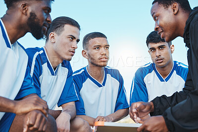 Buy stock photo Sports, soccer coach and a team talking on a field for fitness exercise or outdoor game. Football formation, club and diversity athlete men listen to plan for coaching, scrum and training strategy

