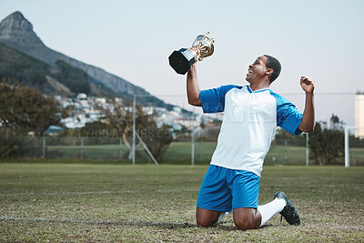 Buy stock photo Soccer player, sports and man celebrate trophy on field for competition game outdoor. Black male athlete champion excited for football prize, award and win or sport achievement and success on a pitch