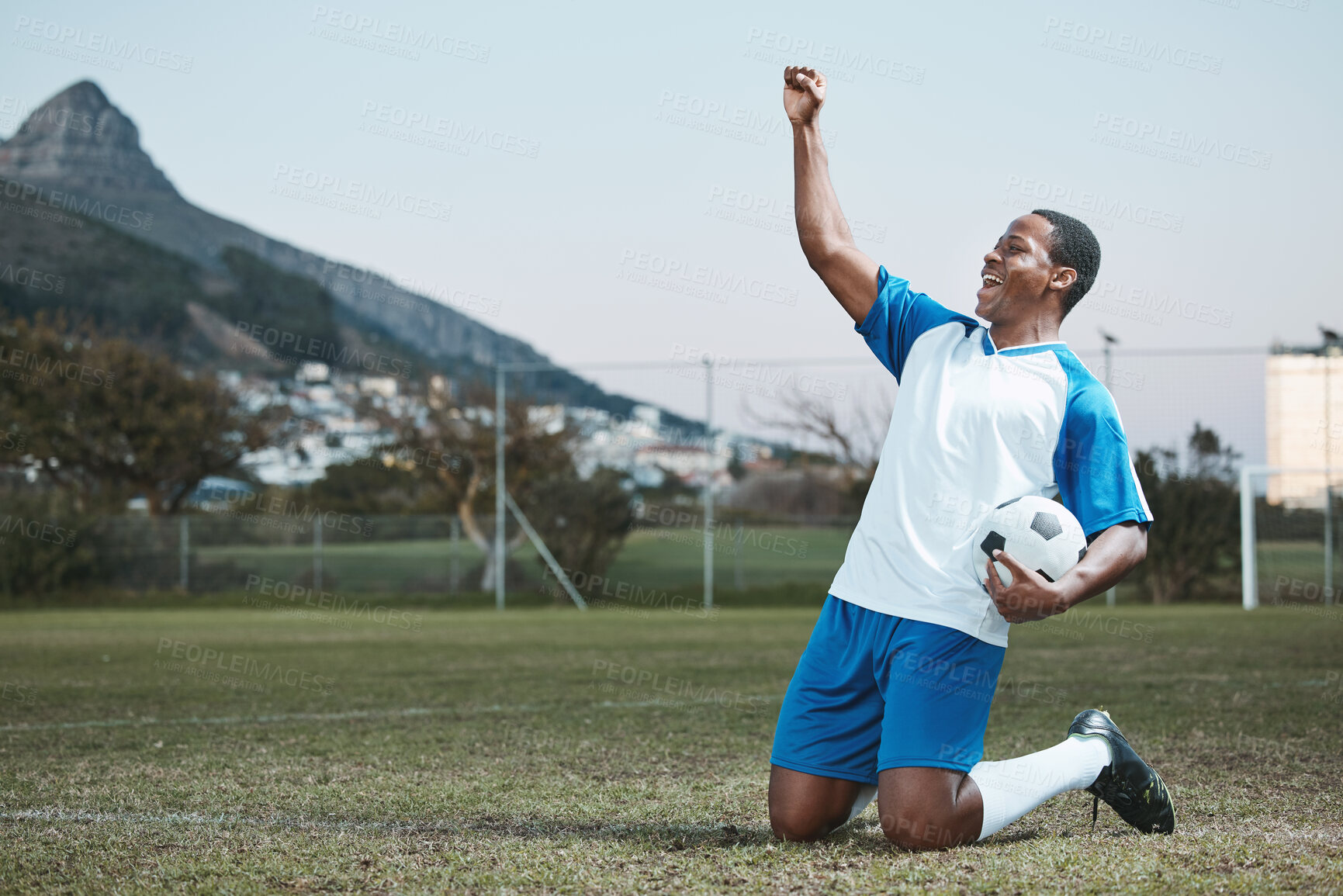 Buy stock photo Sports, soccer ball and man celebrate goal on field for competition or training outdoor. Black male athlete football player, pitch and game celebration for sport achievement, success or win mockup