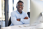 Arms crossed, portrait and a black man at a desk in a call center for online support and service. Smile, pride and an African customer care employee at a computer for telemarketing or sales help