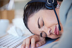 Woman, sleeping and tired at the call center desk, office or working late in customer support, service or consulting. Sleep, rest and burnout in telemarketing, crm or sales job and mental health