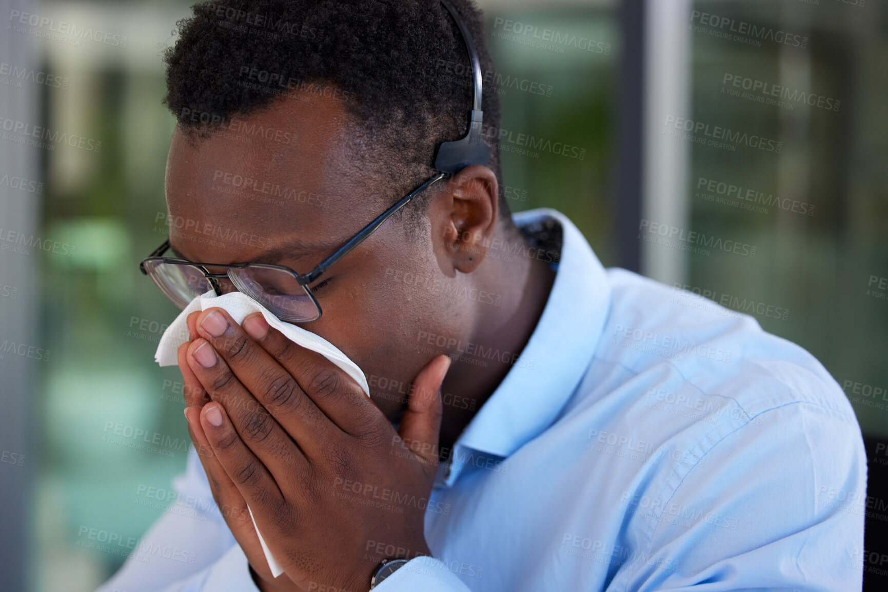 Buy stock photo Call center, business and black man with a tissue, sneeze and flu with allergies, telemarketing and health issue. Male person, consultant and agent with illness, sick and virus with medical symptoms