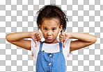 Studio portrait mixed race girl giving thumbs down Cute hispanic child posing inside. Unhappy and upset kid being negative and saying, I disagree or disapprove isolated on a png background. 