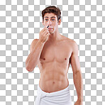 Studio shot of a handsome bare chested young man plucking nose hairs isolated on a png background