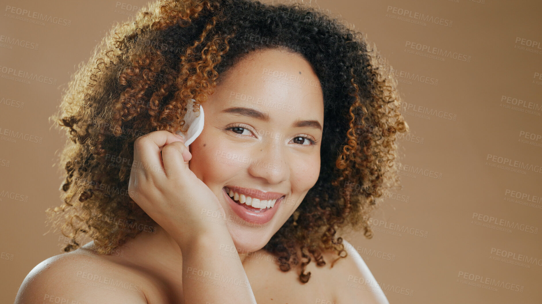 Buy stock photo Cotton, skincare or portrait of a happy woman in studio for cleaning, beauty or dermatology treatment. Brown background, face or proud model with pad for facial, toner and cosmetics with mockup space