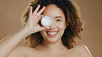 Skincare, face cream and black woman in studio for cosmetology, treatment and wellness on brown background. Beauty, portrait and girl with sunscreen, product or lotion for facial, skin and hygiene