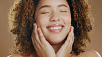 Black woman face, beauty closeup and cosmetic wellness of a model in studio with happiness. Skin glow, cosmetics and young African person with a smile from dermatology skincare with brown background