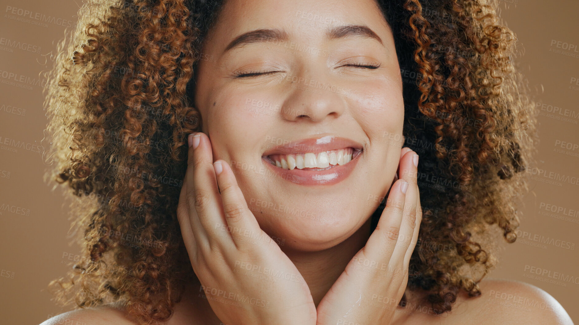 Buy stock photo Face of happy woman, natural or healthy skin for wellness in studio with smile, facial results or glow. Dermatology, relax or confident biracial girl model with skincare cosmetics on brown background