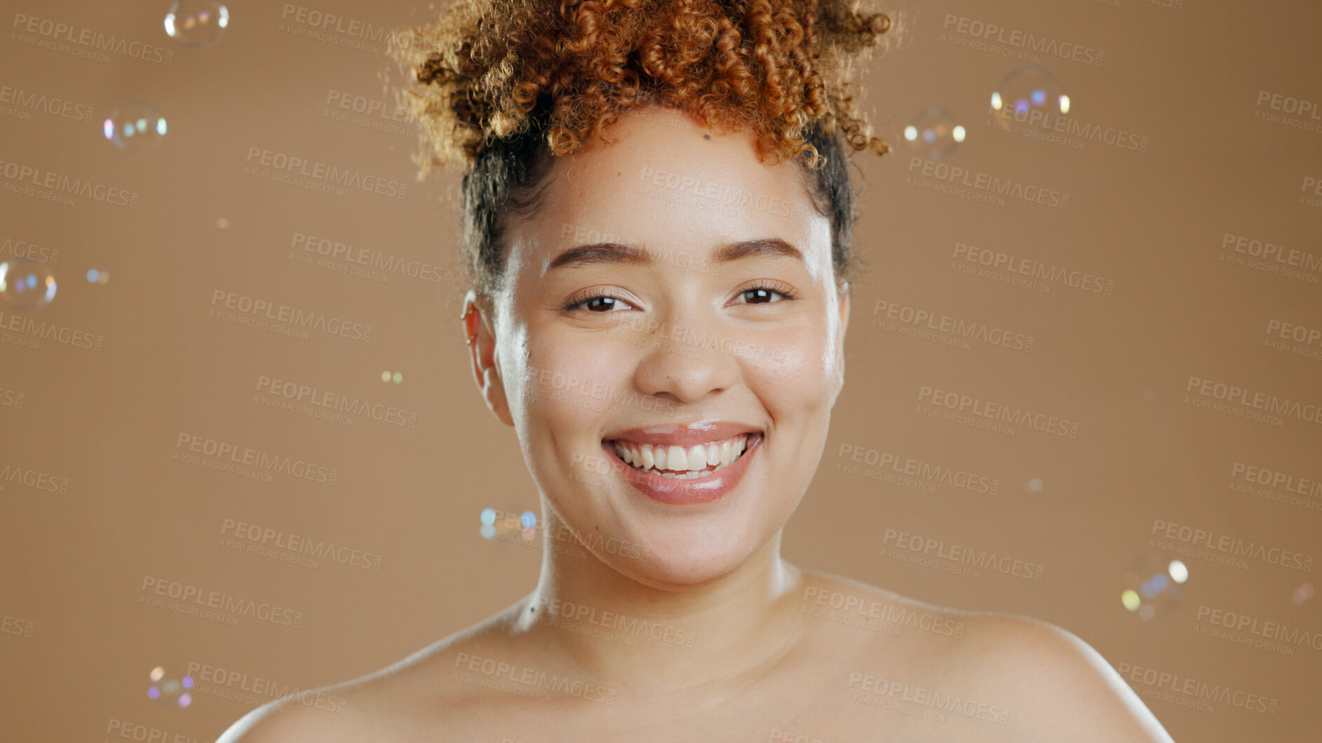 Buy stock photo Woman in portrait, bubbles and skincare for beauty, happy with natural cosmetics and glow on brown background. Dermatology, wellness for skin and liquid soap with self care and anti aging in studio
