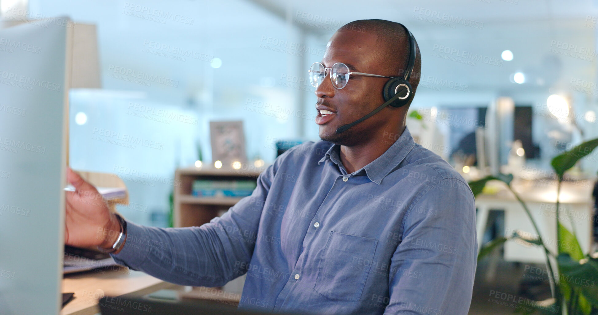 Buy stock photo Call centre, man and headset while talking in office for consultation, telemarketing or customer service. African, person or agent with assistance on website, support or sales with company database