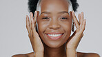 Face, black woman and smile for beauty and skincare glow, happy model and cosmetic care on studio background. Moisturizer, female hands and skin, dermatology with luxury spa treatment in portrait