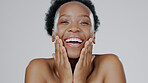 Black woman, face and laughing in beauty portrait, facial and skincare with happiness on studio background. Hands touching skin, natural shine and dermatology, mockup space and cosmetic care wellness