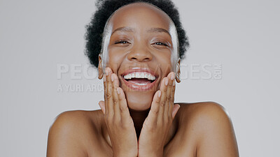 Buy stock photo Face touch, skincare and funny black woman in studio isolated on a gray background. Portrait, hands and natural beauty of model laughing in spa facial treatment, wellness or cosmetics for skin health