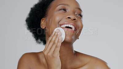 Buy stock photo Face, model and hands for beauty with cleanser, cotton sponge and cosmetic in gray background studio. Black woman, healthy skin and dermatology with self care, facial and skincare aesthetic in mockup