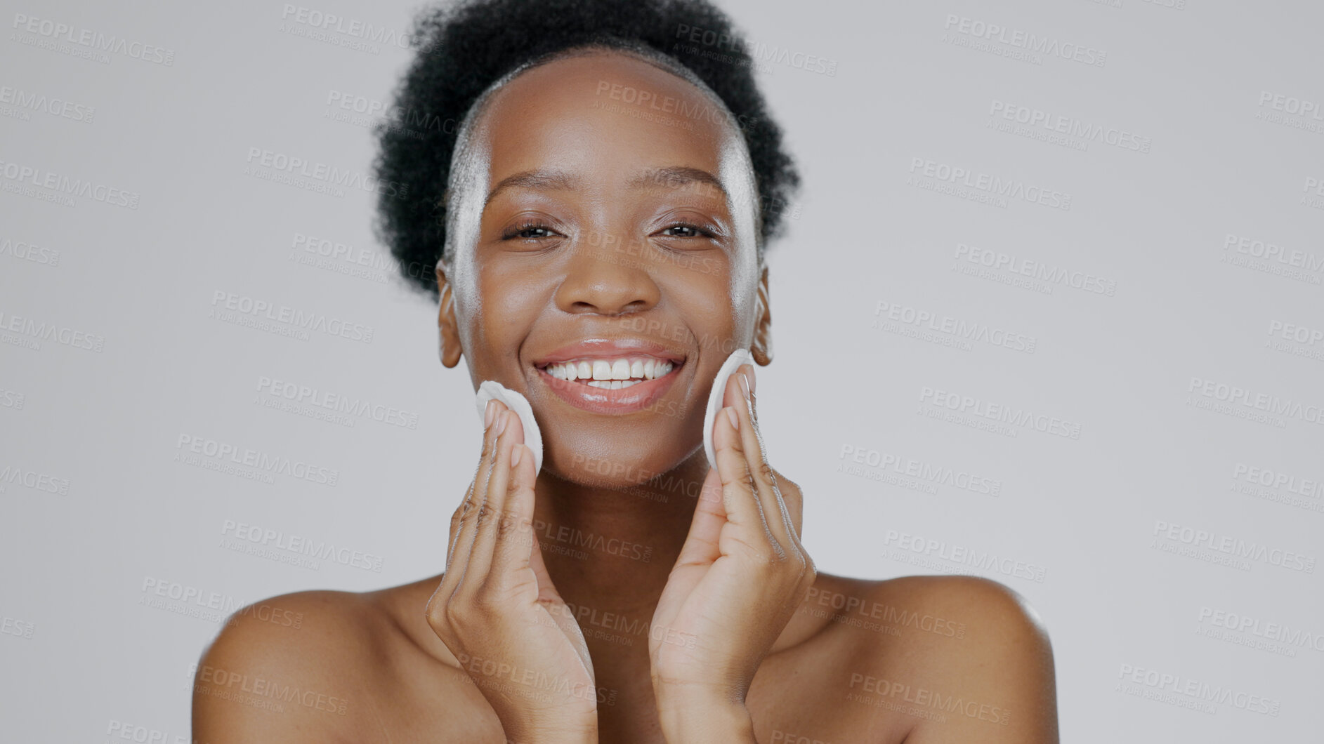 Buy stock photo Face, model and hands with cotton for beauty, facial and cosmetic with happiness in studio background. Black woman, healthy skin and dermatology with self care, spa treatment and aesthetic portrait