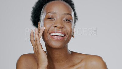 Buy stock photo Happy black woman, portrait and skincare cream for beauty or cosmetics against a studio background. Face of African female person or model smile with lotion, moisturizer or creme for facial treatment