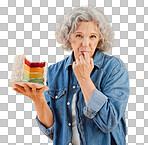 One happy mature caucasian woman holding a colourful cake with a slice missing against isolated on a png background. Smiling white lady showing joy and happiness while celebrating her birthday 