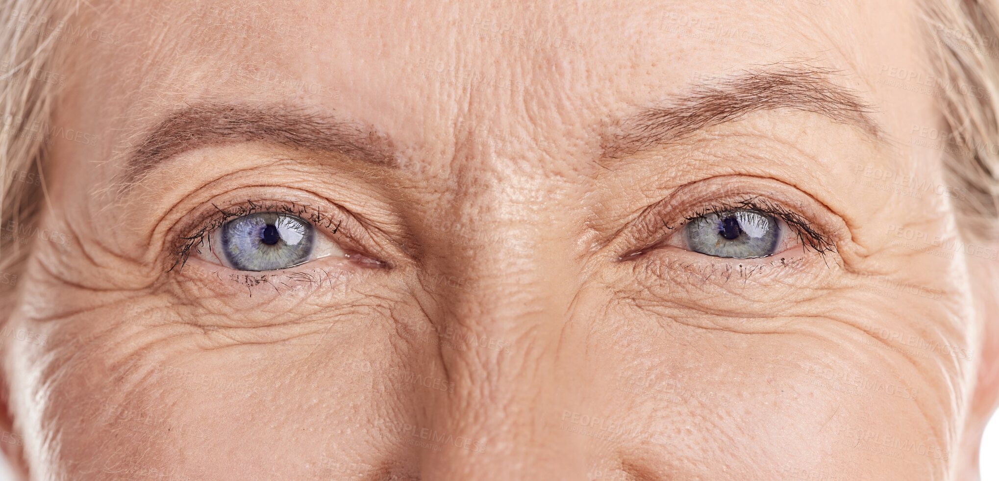 Buy stock photo Closeup, portrait and eyes of a senior woman with wrinkles, contact lens and healthy skin on isolated, transparent or png background. Blue eye, face and zoom on natural beauty and anti aging care