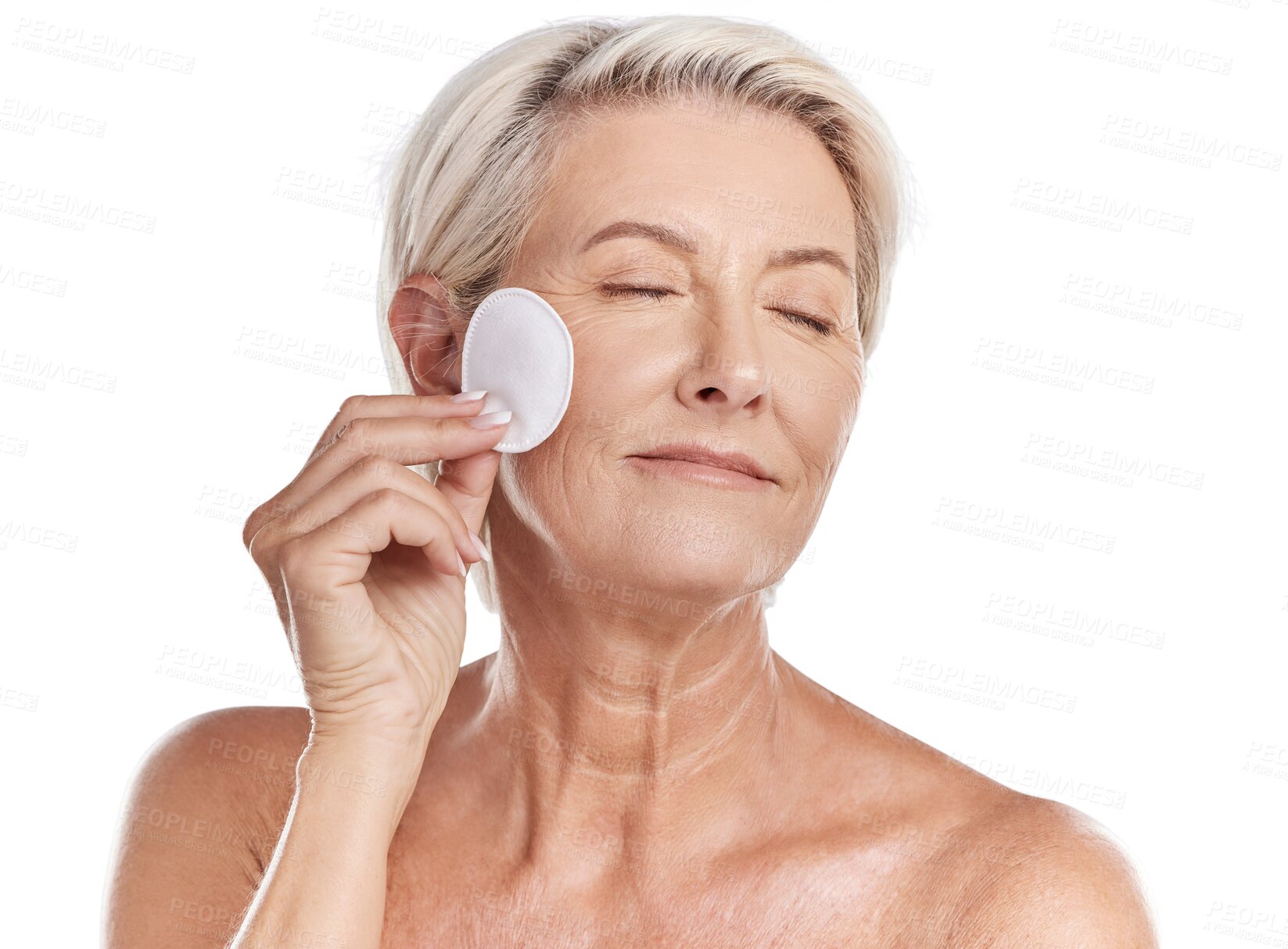 Buy stock photo Senior woman, cotton pad and cleaning face in makeup removal isolated on a transparent PNG background. Happy elderly female person relax for clean hygiene, dermatology or skincare of facial beauty