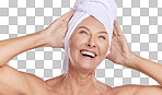 Relaxed mature caucasian woman wearing a towel on her head after enjoying a refreshing shower. Older model using hair a deep conditioner treatment while posing against a grey copyspace background