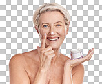 Portrait of one happy mature caucasian woman posing topless against a purple copyspace background. Ageing woman applying cream, moisturiser, sunblock during a skincare routine in a studio
