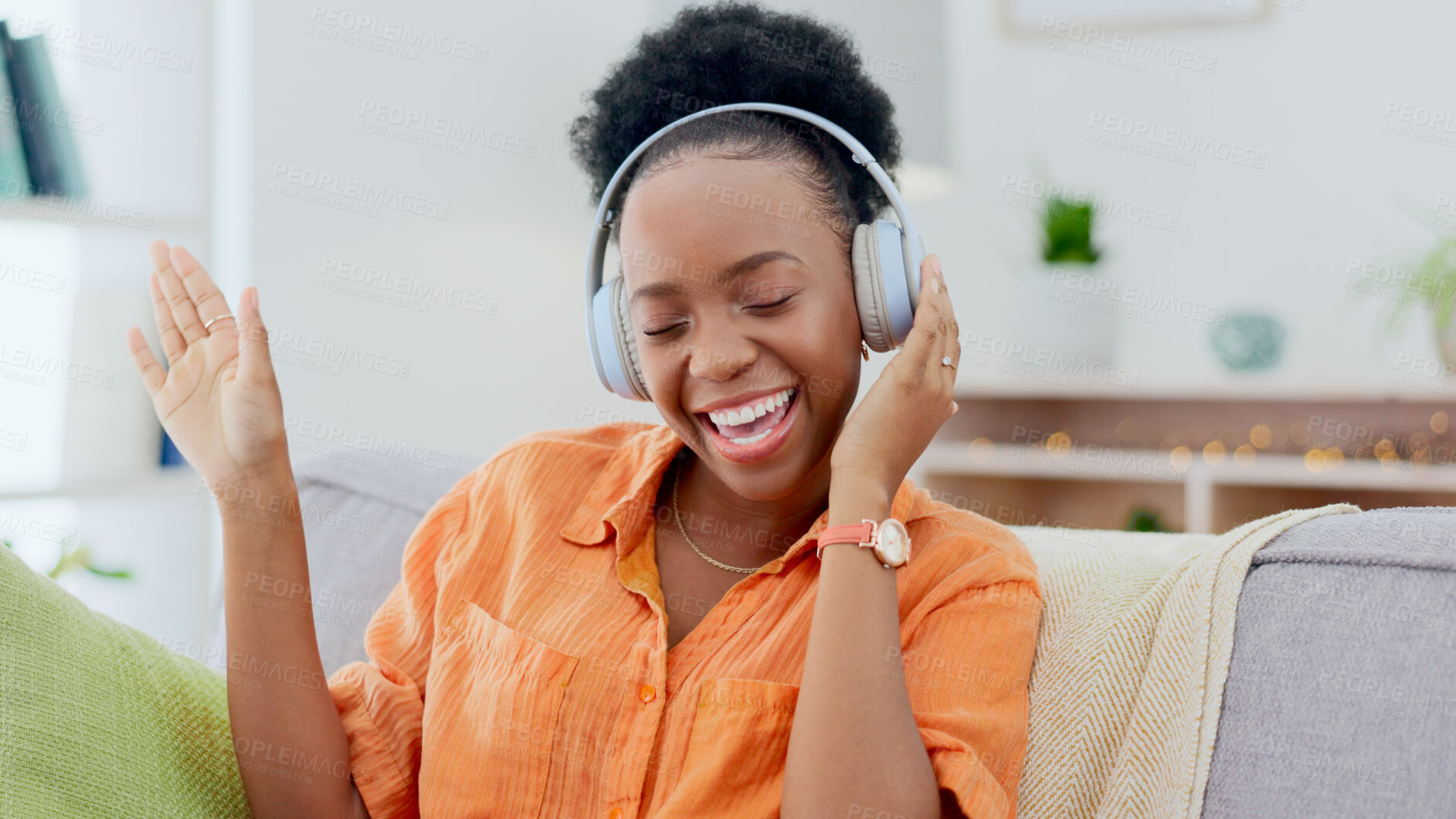 Buy stock photo Dance, headphones or happy black woman on sofa for music streaming, mental health or wellness. Energy, couch or fun African person listening to audio technology and singing a hip hop song to relax