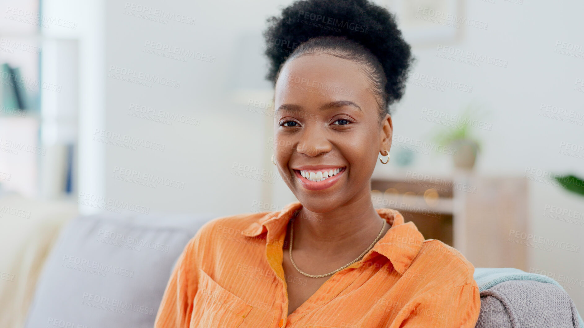Buy stock photo Portrait, relax and smile with a black woman on a sofa in the living room of her home during the weekend. Face, freedom and afro with a happy young person alone in the lounge of her apartment
