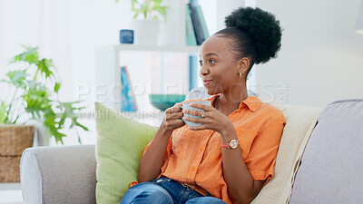 Buy stock photo Black woman, smiling and sofa with hot beverage, relaxing and house for self care, lounge and break. Me time, comfort and quality time in home, lounge and day off for resting, laughing and happiness