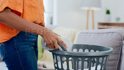 Buy stock photo Hands, housework and woman folding laundry in a living room, cleaning and tidy in her home. Hand, girl and female with clean towels, sorting and packing on the weekend for hygiene and household task