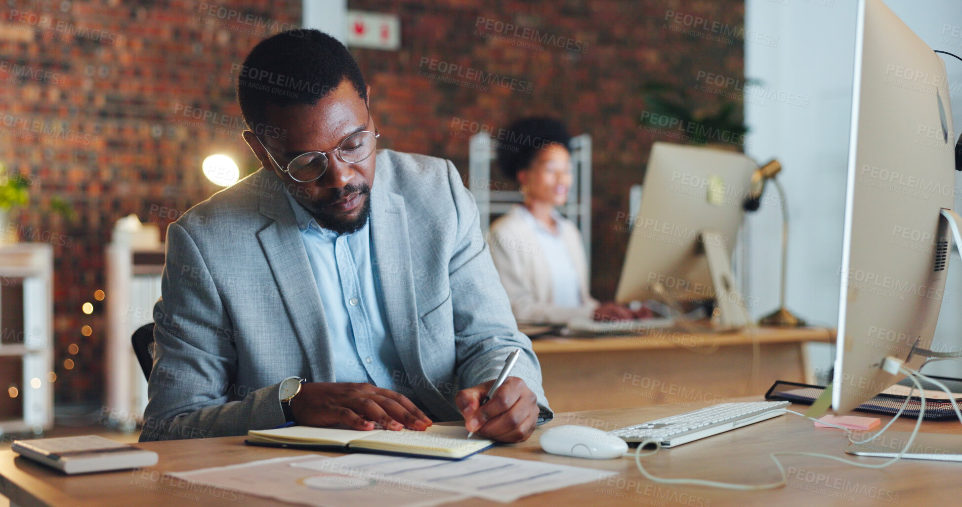 Buy stock photo Black man, planning and writing notes in office with business  agenda, administration or review of schedule. Businessman, notebook and report on computer research, information or management strategy 