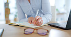 Woman hands, writing notes and laptop typing to schedule agenda, office administration and reminder. Closeup worker, notebook and computer planning of ideas, review information and research strategy