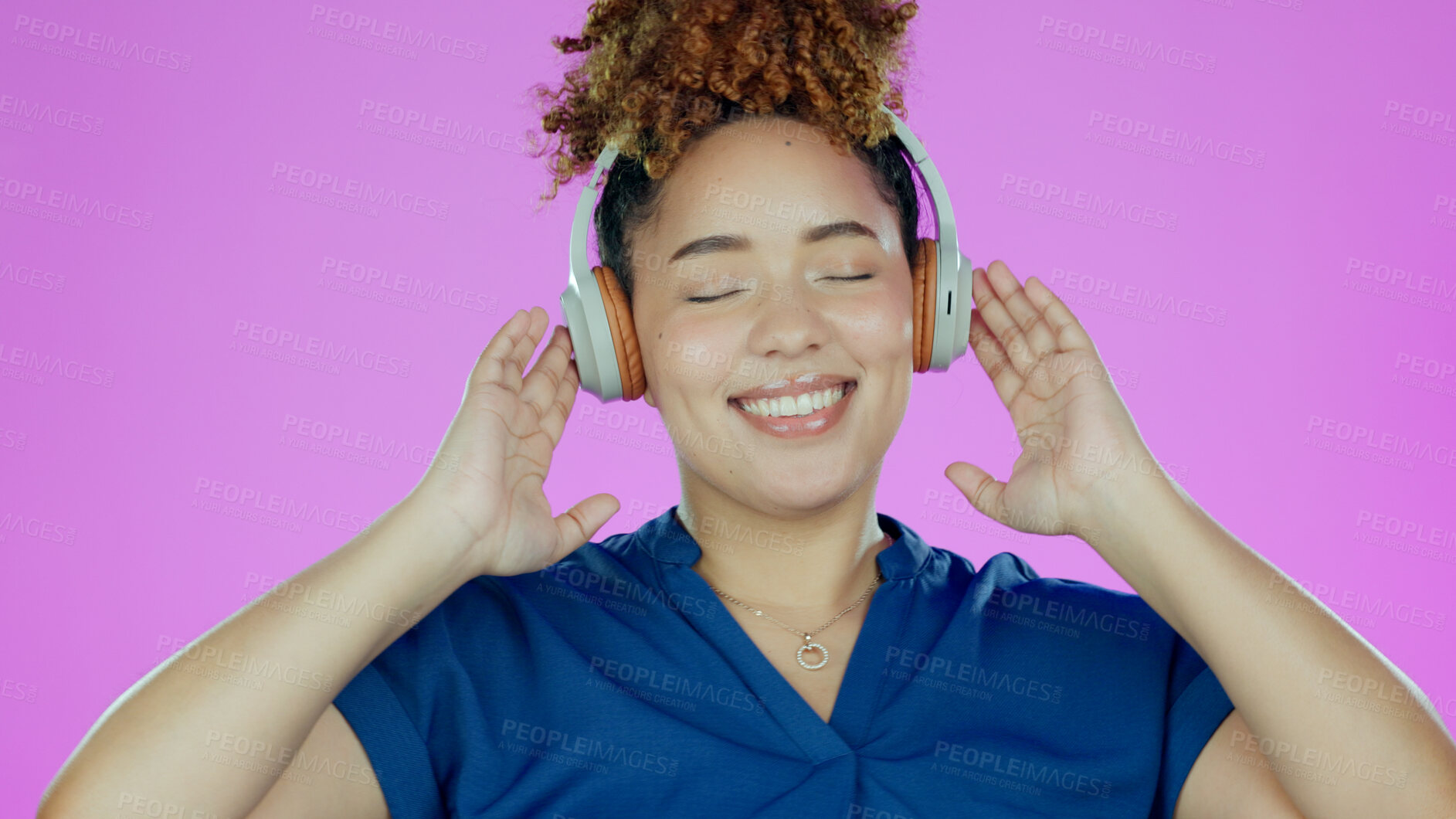 Buy stock photo Headphones, happy and woman with music in studio listening to song, audio and radio. Dance, happiness and face of person for streaming subscription, relax and fun on purple background for wellness