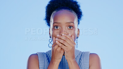 Buy stock photo Woman, shock and hands on face for gossip, news and drama in studio by blue background. Black model, surprise and emoji for secret, alarm and disaster in information, wtf and anxiety in mockup